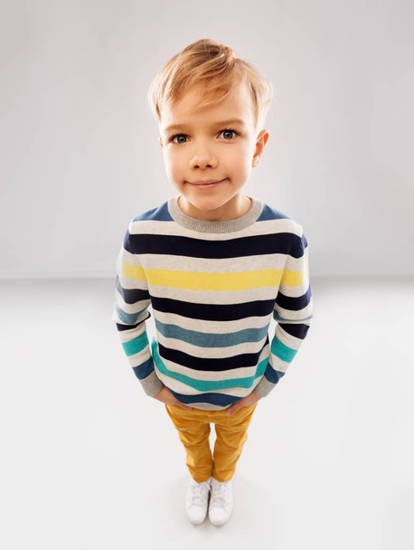 portrait of nice boy in striped pullover - 写真・画像