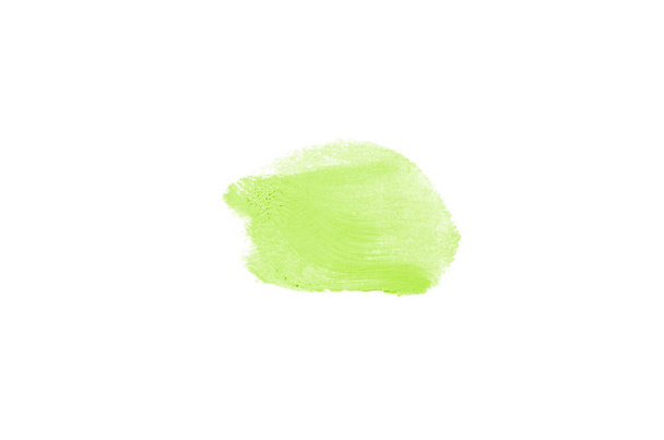 Mancha y textura de lápiz labial o pintura acrílica aislada sobre fondo blanco. Color verde claro
 - Foto, Imagen