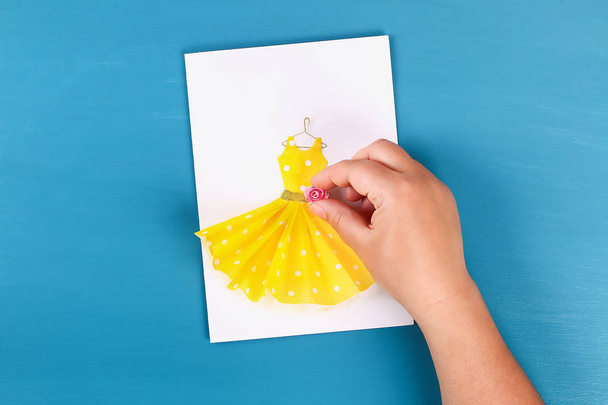 Diy Mothers Day greeting card with a paper napkin dress and flower decoration. - Photo, image