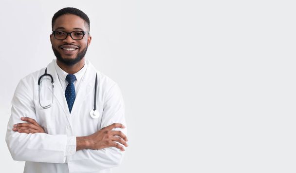 Happy Doctor In White Uniform Against Light Background - Photo, image
