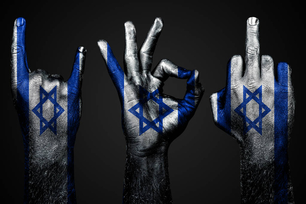 a set of three hands with a painted flag Israel show middle finger, goat and Okay, a sign of aggression, protest and approval on a dark background. - Foto, Imagem