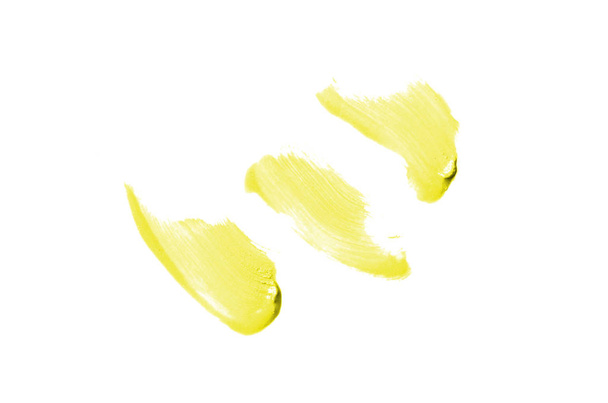 Smear ja tekstuuri huulipunaa tai akryylimaalia eristetty valkoisella pohjalla. Keltainen väri
 - Valokuva, kuva