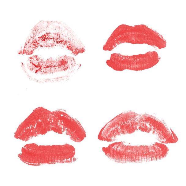 女性の唇の口紅のキスプリントは、白で隔離されたバレンタインデーのために設定されています。赤色 - 写真・画像