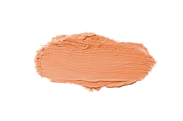 Smear and texture of lipstick or acrylic paint isolated on white background. Orange color - Fotó, kép
