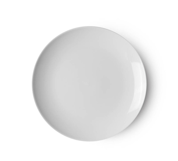 Pusta ceramiczna okrągła płyta izolowana na białym tle. widok z góry - Zdjęcie, obraz