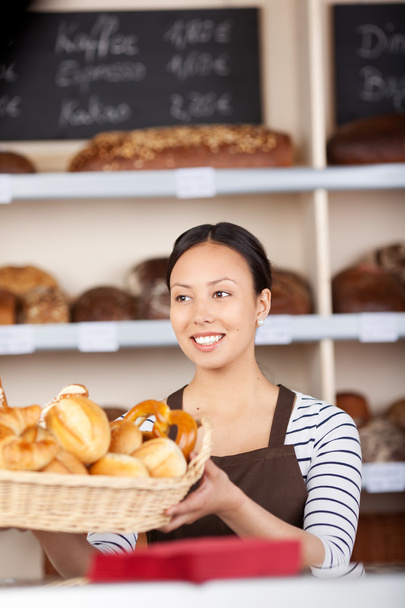 young saleswoman at work in bakery - Foto, imagen