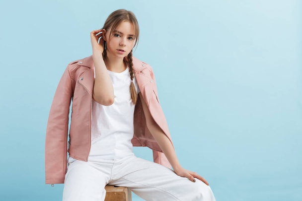 Young beautiful girl with two braids in pink leather jacket and  - Foto, Imagem
