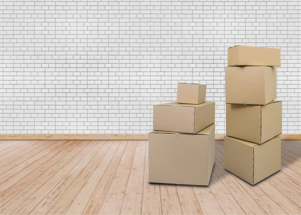 Moving in new home. Empty room with Carton boxes - Фото, изображение