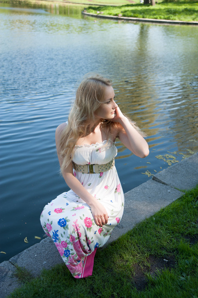 beautiful blonde near the water - Fotó, kép