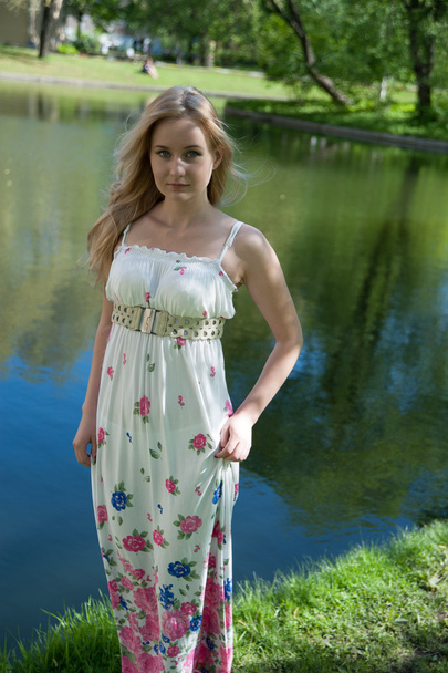 beautiful blonde near the water - Zdjęcie, obraz