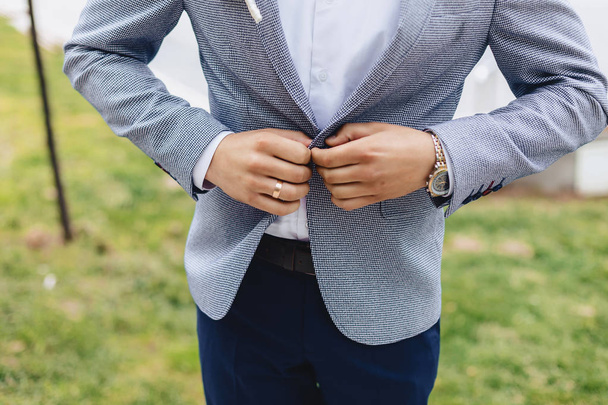 groom meeting, details, jacket, shoes, watches and buttons on the wedding day - 写真・画像