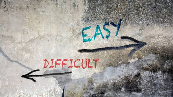 Wall Graffiti to Easy versus Difficult - Photo, Image