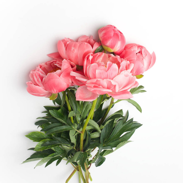 bouquet of fresh peonies on a white background in the center of the frame. flat lay, top view - Valokuva, kuva