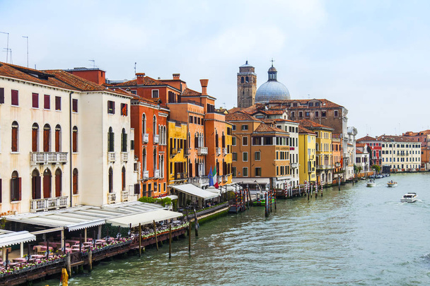 Venice, Italy, on April 25, 2019. View of Canal Grande. Various boats float by a fine architectural complex of embankments - 写真・画像