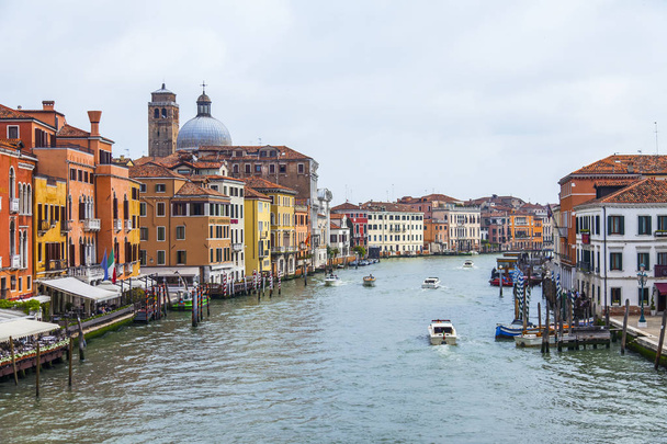 Venice, Italy, on April 25, 2019. View of Canal Grande. Various boats float by a fine architectural complex of embankments - Fotoğraf, Görsel