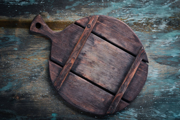 Kitchen board on a dark background. Top view. Free copy space. - 写真・画像