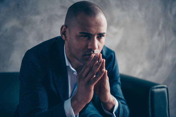 Close-up portrait of his he nice stylish classy guy wearing jacket executive director top manager ceo boss chief sitting on couch thinking praying at workplace workstation concrete wall - Fotoğraf, Görsel