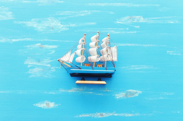 wooden vintage boat over blue background - Fotografie, Obrázek
