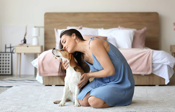 Young woman with cute dog at home - Foto, Imagem