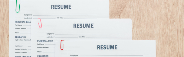 panoramic shot of personal resume templates and pen on wooden surface - Photo, Image
