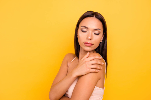 Close up side profile photo beautiful she her lady big lips eyes closed overjoyed skin condition spa procedure treatment wear casual pastel tank-top outfit clothes isolated yellow bright background - Zdjęcie, obraz