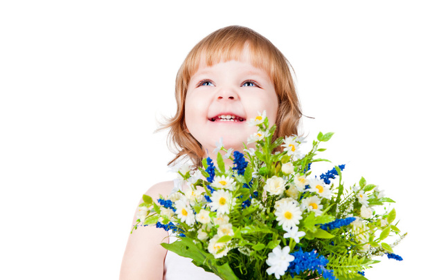 Beautiful little girl with flowers - Foto, imagen