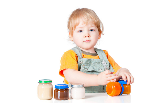 Boy with little jars of baby food - Photo, image