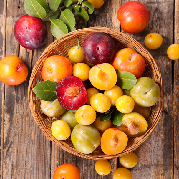 basket with different variety of plum - Photo, Image