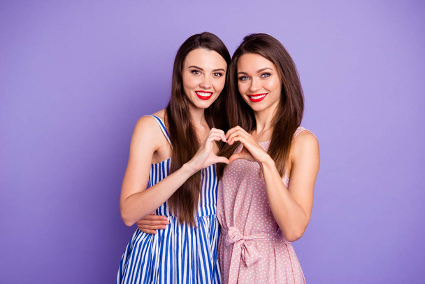 Portrait of nice-looking charming cute lovely lovable glamorous winsome attractive shine cheerful cheery positive tender ladies showing heart sign shape isolated over pastel violet background - Foto, Imagem