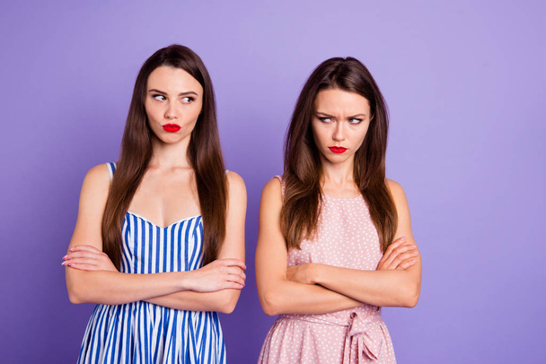 Close up portrait two people amazing beautiful she her lady classy chic had fight not speak tell talk each other offense wear pretty colorful dresses isolated purple violet bright vivid background - Foto, Imagem