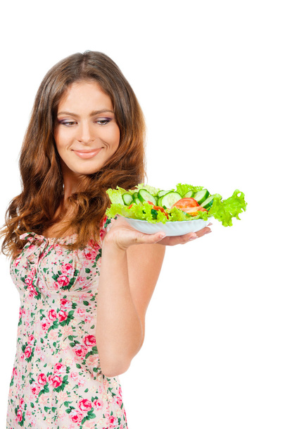 Chica sosteniendo un plato con ensalada
 - Foto, Imagen