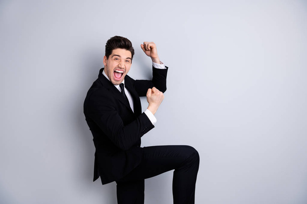Portrait emotional boss  youth thrilled stylish scream shout yeah expression partnership concept raise fists yeah impressed contract modern classic black blazers isolated grey background - Foto, Bild