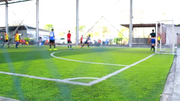 the corner of football field with blurry players background, corner for corner kick with blurry soccer players, soccer training or football match. - Footage, Video