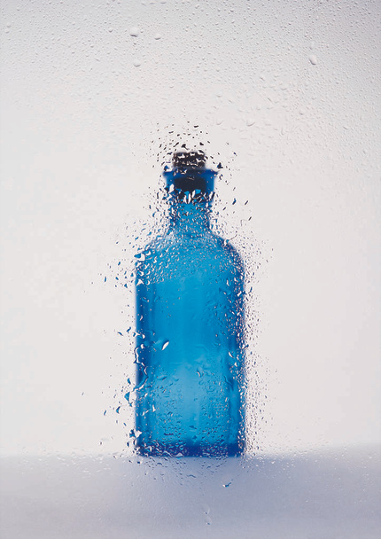 close up view of glass bottle on background - Foto, afbeelding