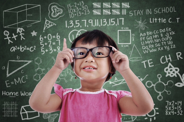 Asian girl wear glasses in class - Фото, изображение