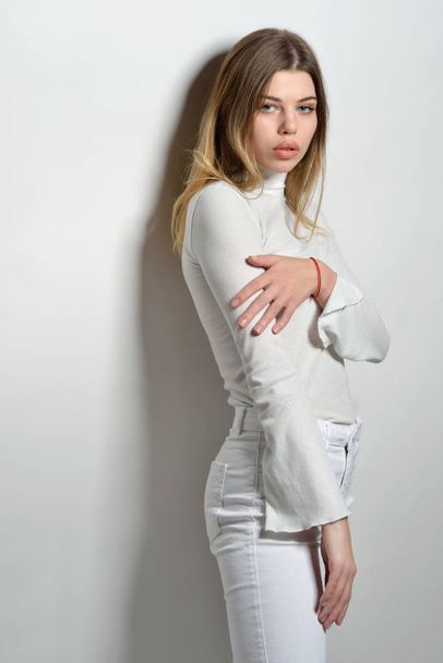 sexy beautiful woman in white clothes posing in studio with whit - Zdjęcie, obraz