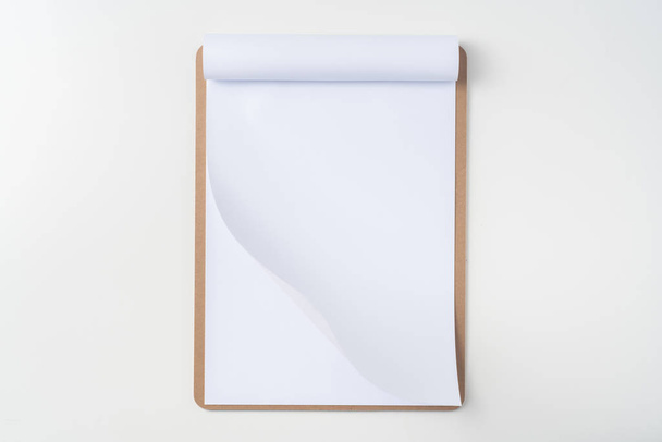 Top view of white A4 flipped paper on brown clipboard isolated on white background for mockup. - Φωτογραφία, εικόνα