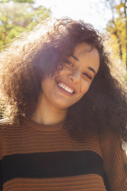 Young afro american woman looking at camera and smiling. - Foto, imagen