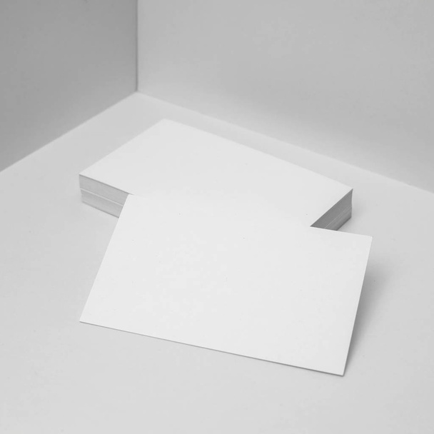 Blank business cards on white background for mockup. - 写真・画像