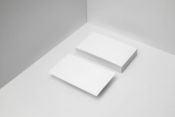 Blank business cards on white background for mockup. - Фото, зображення