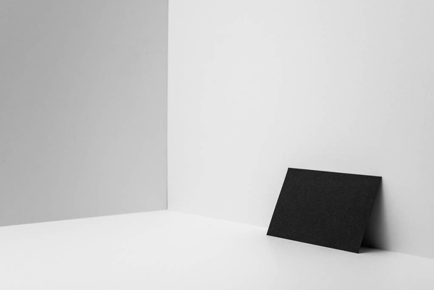 Black business card on white background for mockup. - Foto, afbeelding