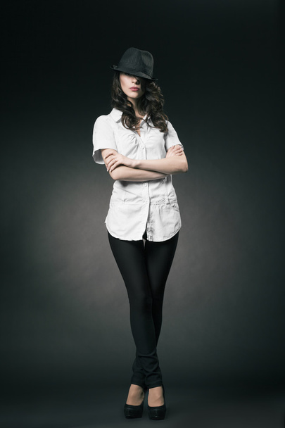 Beautiful brunette girl with black classic hat - Fotografie, Obrázek