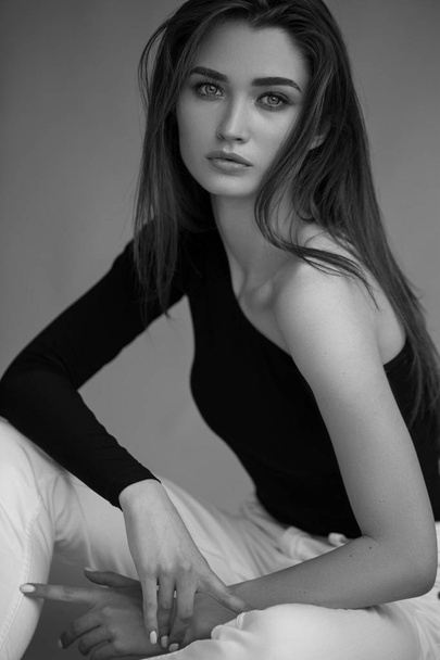 Fashion minimalist dark portrait of brunette female model  - Photo, Image