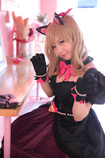 Japani anime cosplay, muotokuva tyttö cosplay vaaleanpunainen huone takaisin
 - Valokuva, kuva