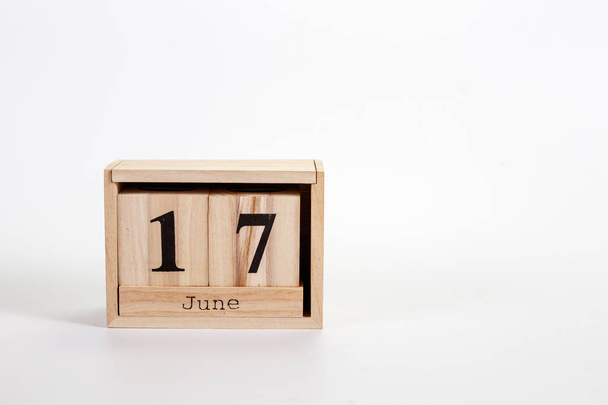 Wooden calendar June 17 on a white background - Photo, Image