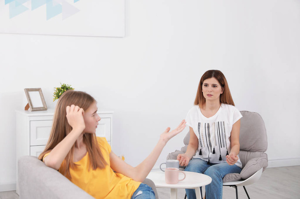Mother scolding her teenager daughter at home - Photo, Image