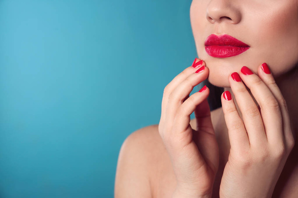 Beautiful woman with stylish nail polish on color background, closeup. Space for text - Fotografie, Obrázek