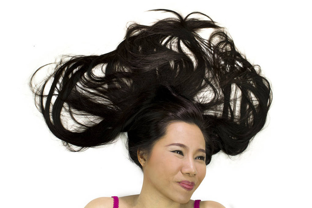 Closeup portrait of happy asian women  lying on ground with blac - Foto, imagen