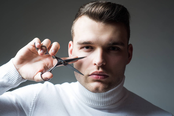 Create your style. Macho confident barber cut hair. Barbershop service concept. Professional barber equipment. Cut hair. Man strict face hold scissors. Barber glossy hairstyle hold steel scissors - Foto, imagen