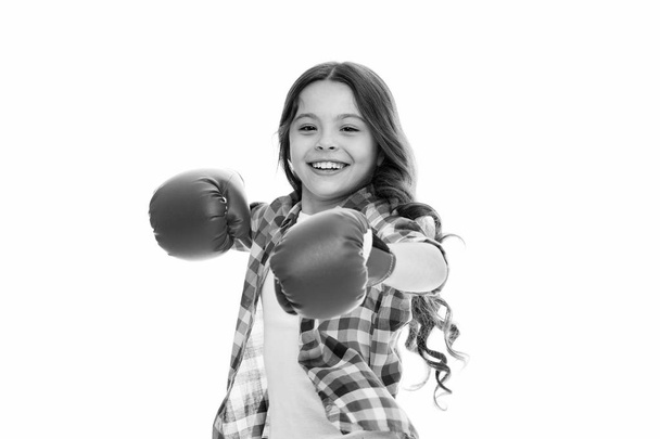 Kid strong and independent girl. Feel strong and independent. Girls power concept. Upbringing confidence and strong character. Female rights and liberties. Girl boxing gloves ready to fight - Photo, image